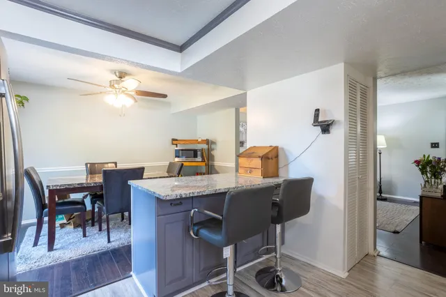 a kitchen with a sink stove top oven and cabinets