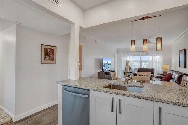 a kitchen with sink and window