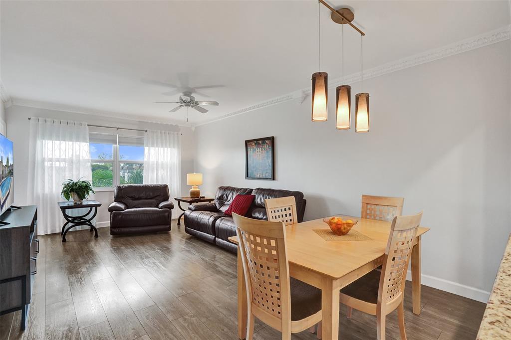 3405 Northwest 48th Avenue, Unit 611 Lauderdale Lakes, FL 33319 - Photo 15 of 34 a living room with furniture and a wooden floor