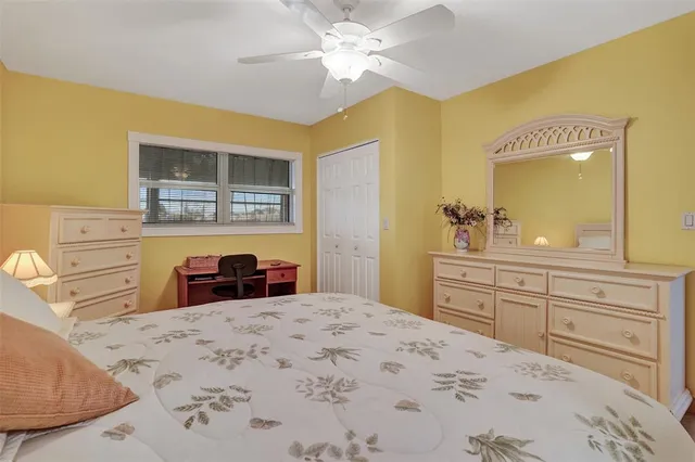 a bedroom with a bed and a dresser