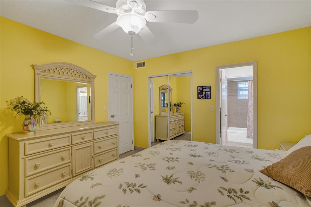 3405 Northwest 48th Avenue, Unit 611 Lauderdale Lakes, FL 33319 - Photo 20 of 34 a bedroom with a bed and a dresser in it