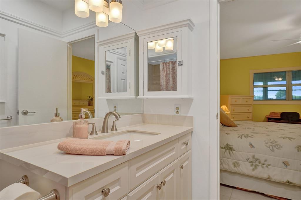 3405 Northwest 48th Avenue, Unit 611 Lauderdale Lakes, FL 33319 - Photo 21 of 34 a bathroom with a sink and a mirror