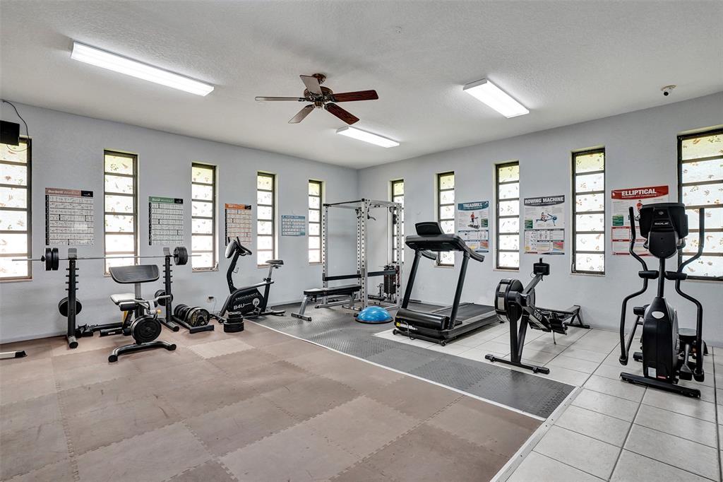 3405 Northwest 48th Avenue, Unit 611 Lauderdale Lakes, FL 33319 - Photo 25 of 34 a view of a room with gym equipment