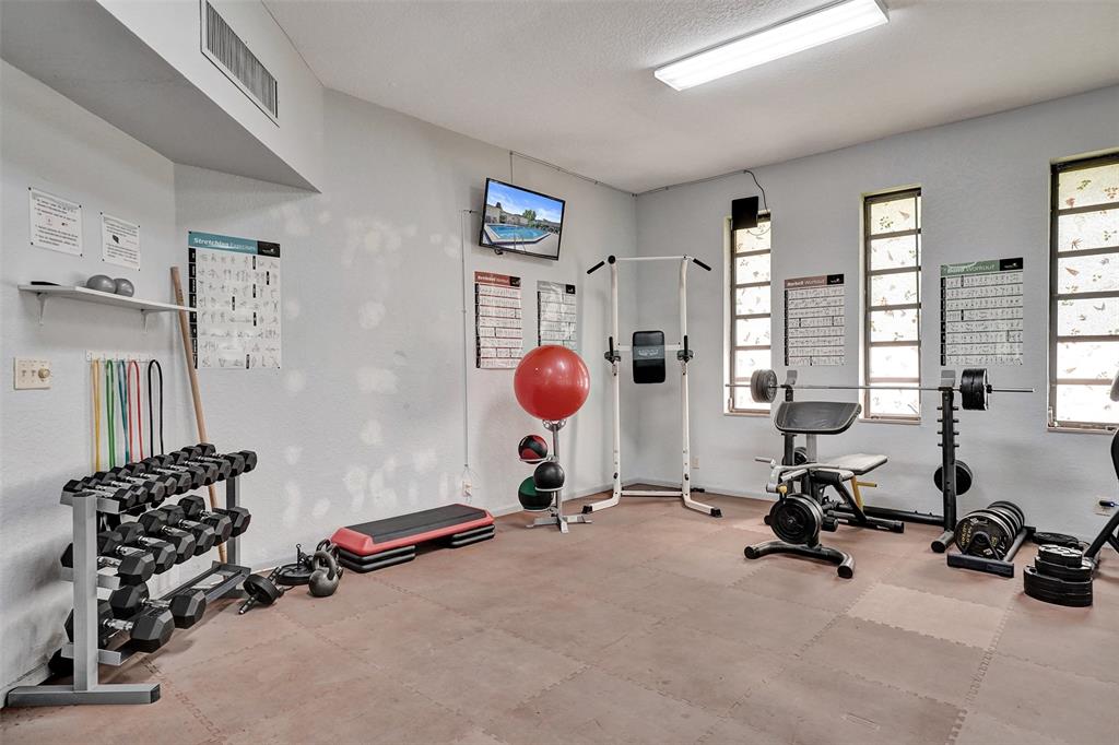 3405 Northwest 48th Avenue, Unit 611 Lauderdale Lakes, FL 33319 - Photo 26 of 34 a room with gym equipment and a large window