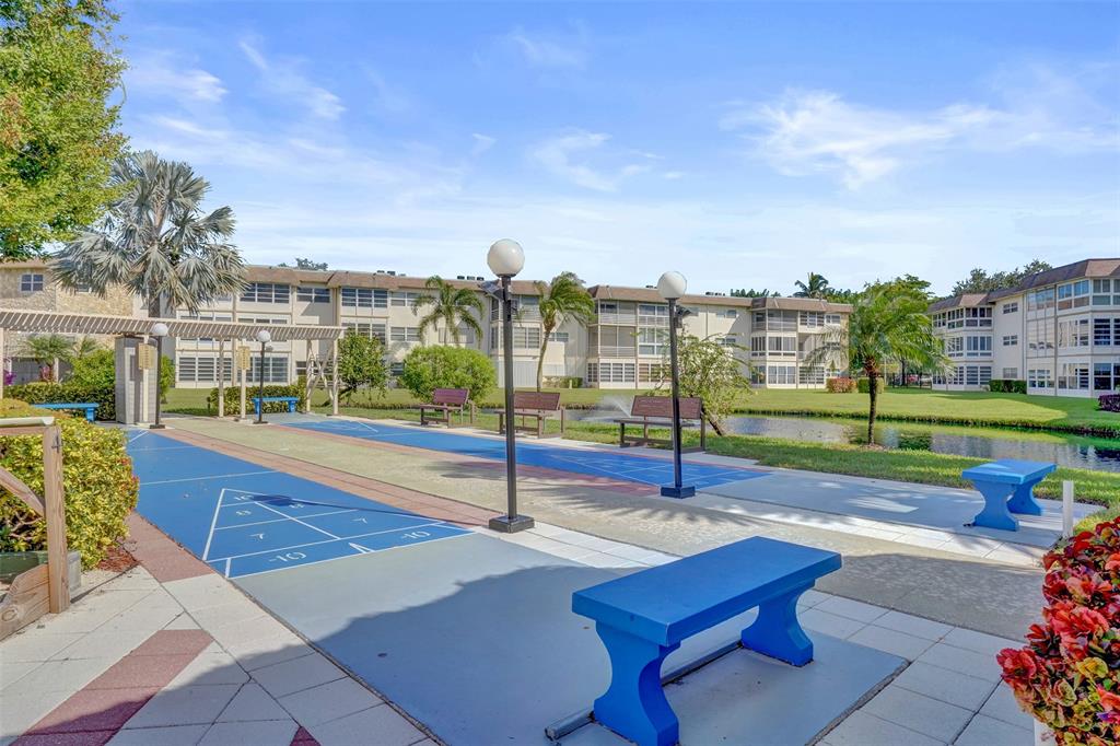 3405 Northwest 48th Avenue, Unit 611 Lauderdale Lakes, FL 33319 - Photo 28 of 34 a view of a patio with a fountain