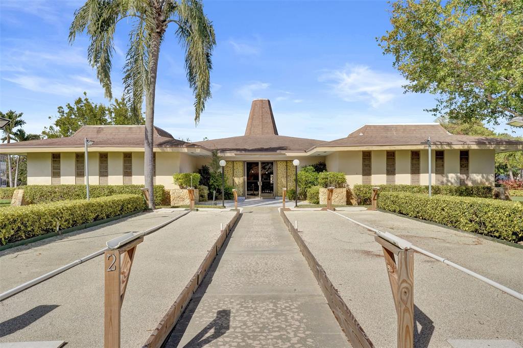 3405 Northwest 48th Avenue, Unit 611 Lauderdale Lakes, FL 33319 - Photo 30 of 34 a front view of a house with a yard