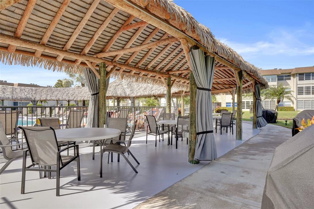 3405 Northwest 48th Avenue, Unit 611 Lauderdale Lakes, FL 33319 - Photo 31 of 34 a view of a chairs and table in the patio