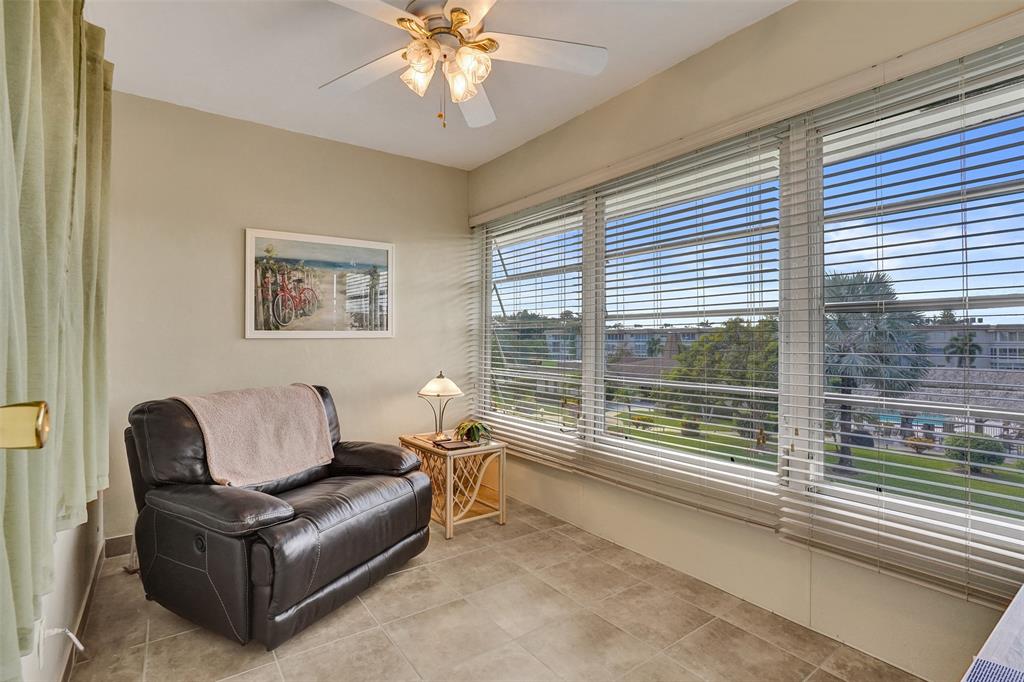 3405 Northwest 48th Avenue, Unit 611 Lauderdale Lakes, FL 33319 - Photo 8 of 34 a living room with furniture and a large window