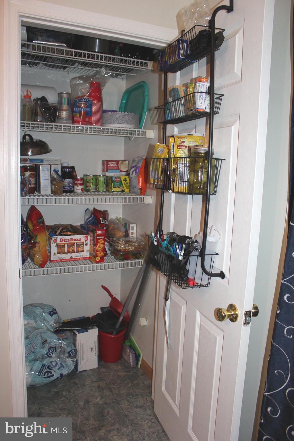 320 South Mill Street St. Clair, PA 17970 - Photo 11 of 37 a room with water heater and a wooden floor