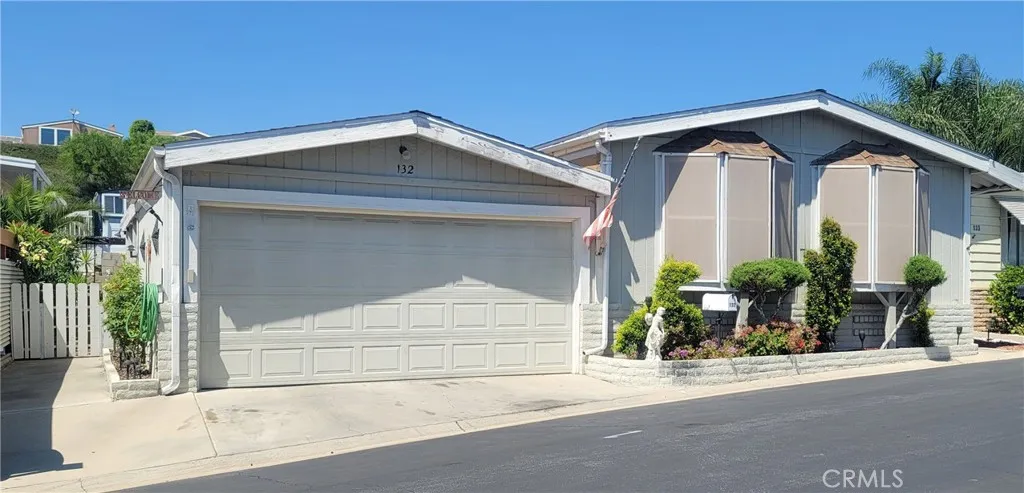 a view of a house with a yard and garage