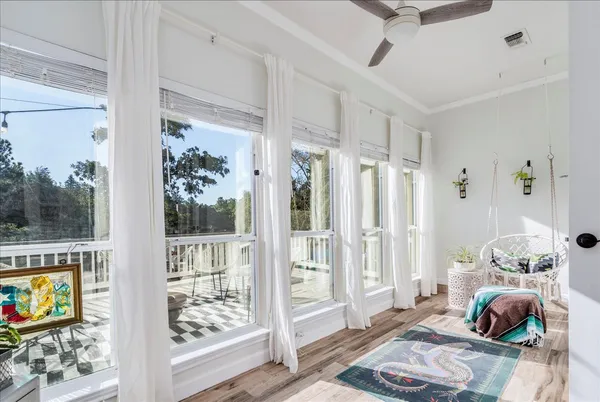 a bedroom with furniture and a window