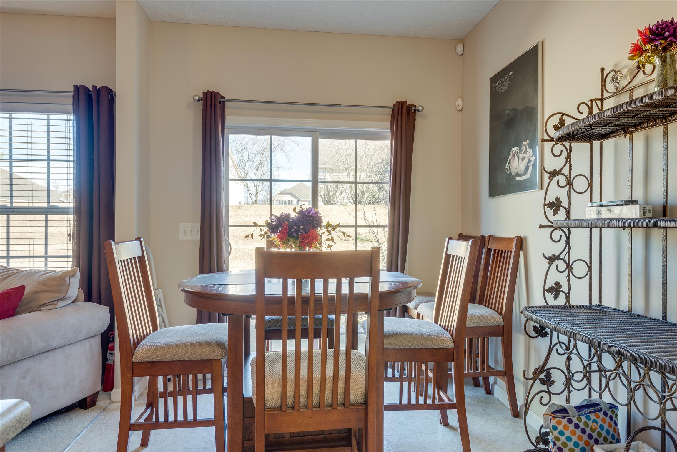 8215 Rossi Road Brentwood, TN 37027 - Photo 13 of 26 a view of a dining room with furniture window and outside view
