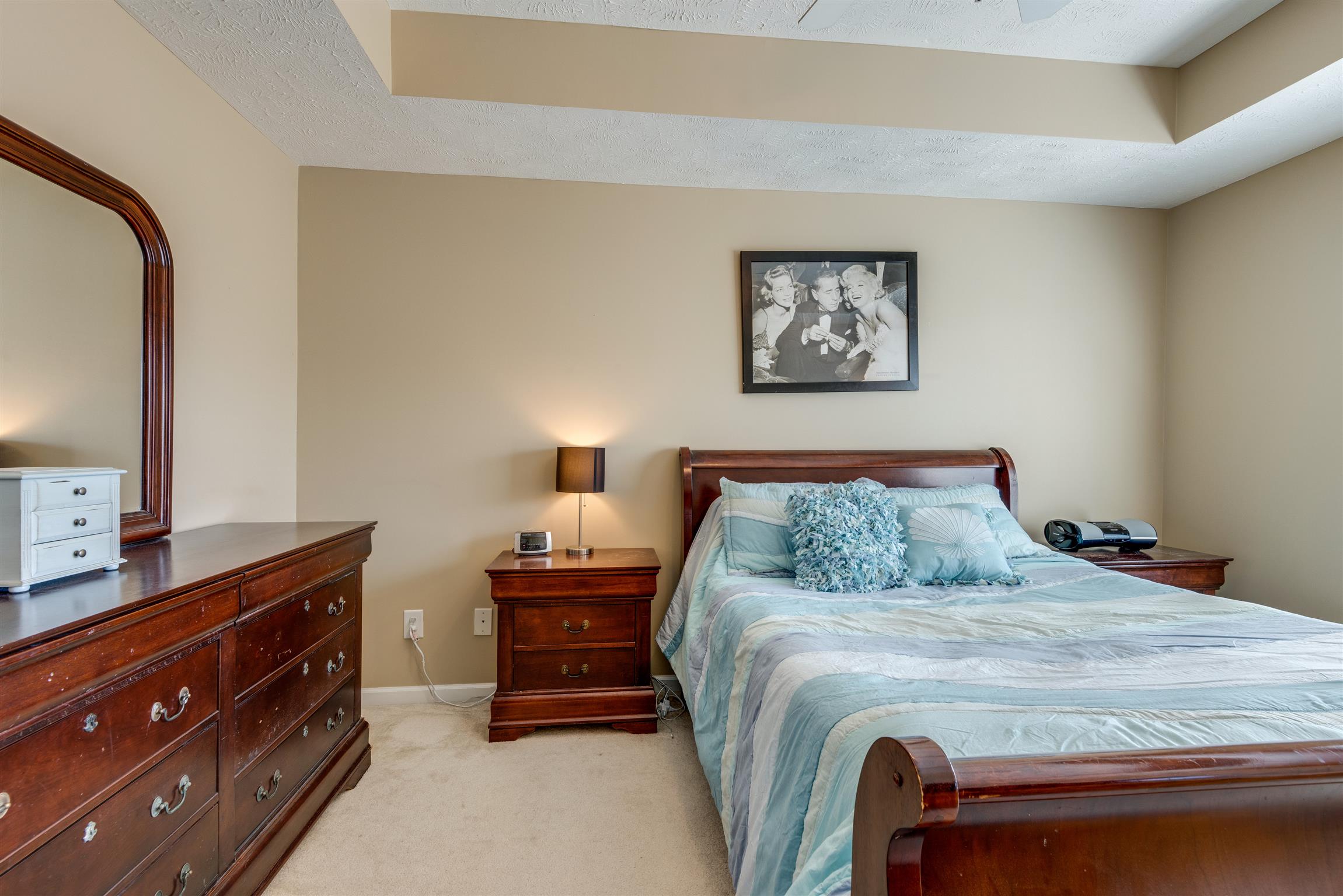 8215 Rossi Road Brentwood, TN 37027 - Photo 15 of 26 a bedroom with a bed and a dresser