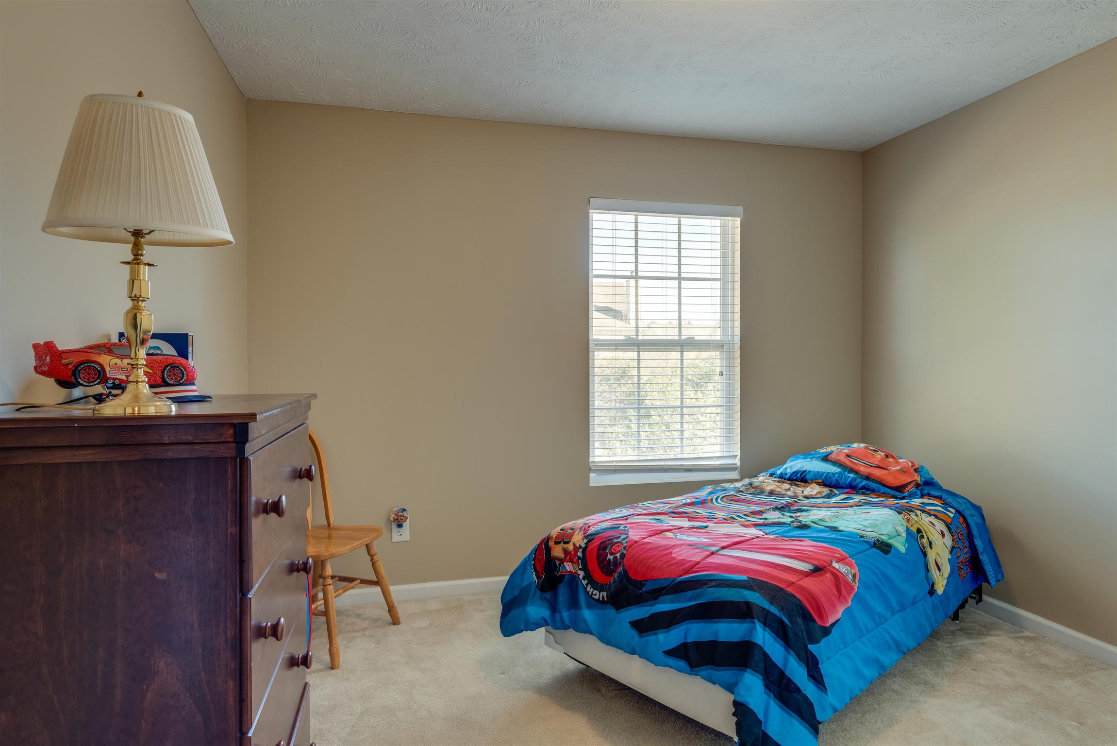 8215 Rossi Road Brentwood, TN 37027 - Photo 18 of 26 a bedroom with a bed and a window