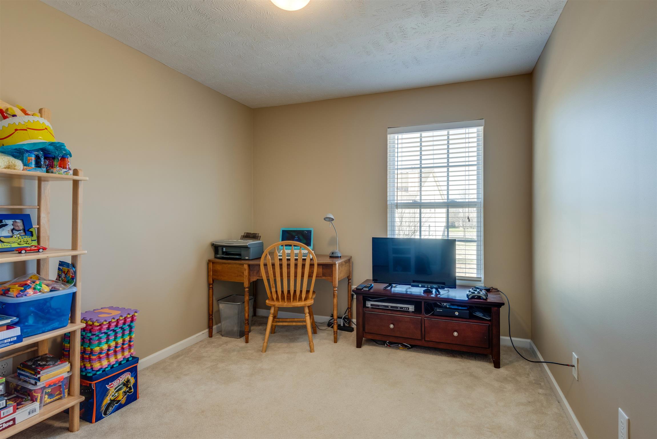 8215 Rossi Road Brentwood, TN 37027 - Photo 19 of 26 a living room with furniture and a window