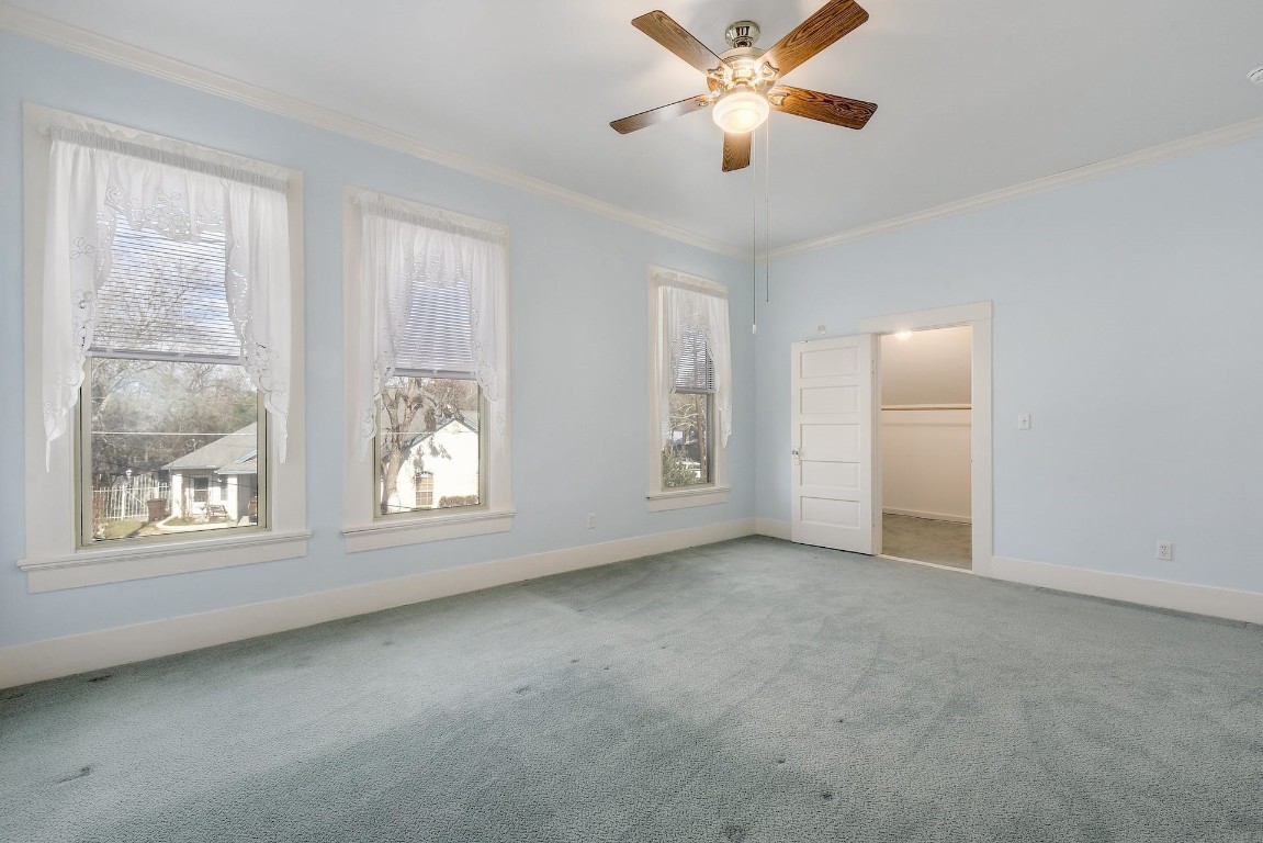 205 South Rio Grande Street Lockhart, TX 78644 - Photo 25 of 30 an empty room with windows and fan