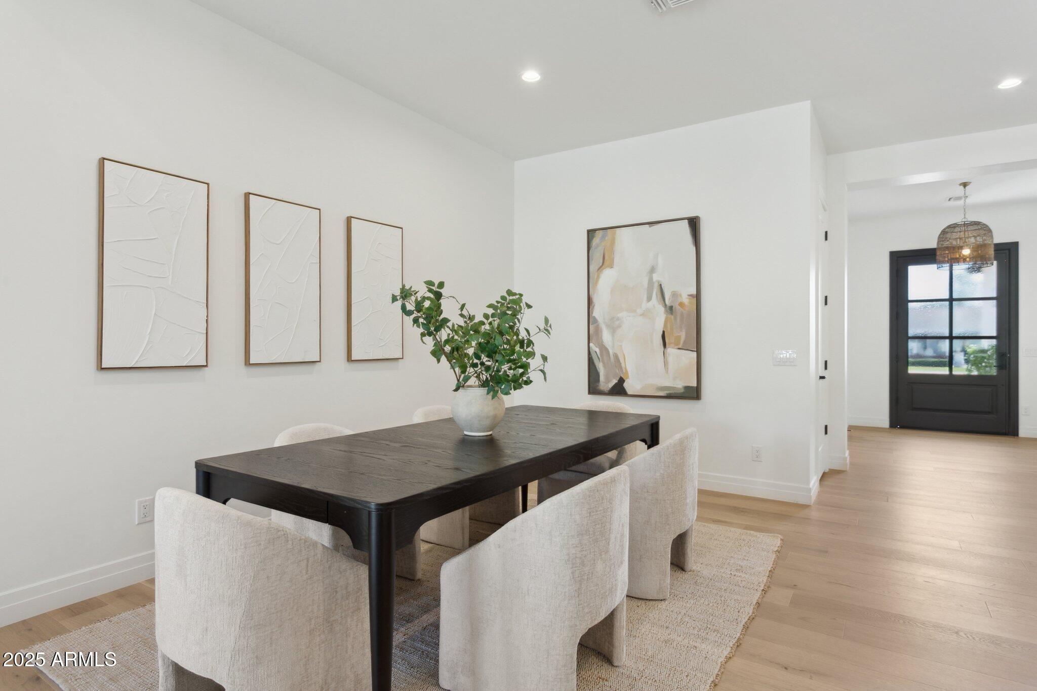 2942 North 47th Place Phoenix, AZ 85018 - Photo 11 of 40 a dining hall with stainless steel appliances kitchen island granite countertop a living room