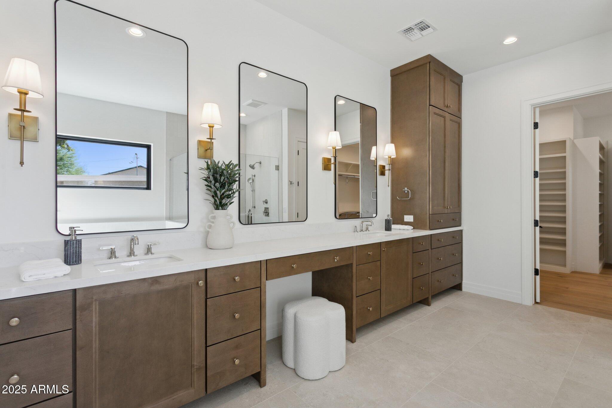 2942 North 47th Place Phoenix, AZ 85018 - Photo 18 of 40 a bathroom with a double vanity sink mirror and double