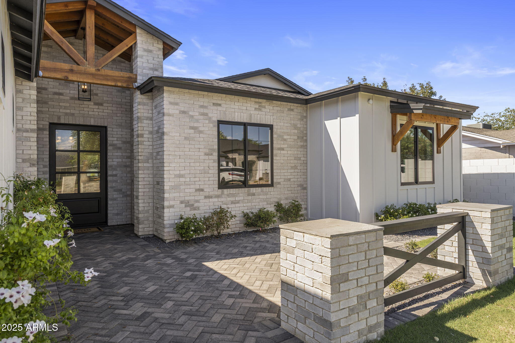 2942 North 47th Place Phoenix, AZ 85018 - Photo 2 of 40 a front view of a house with garden