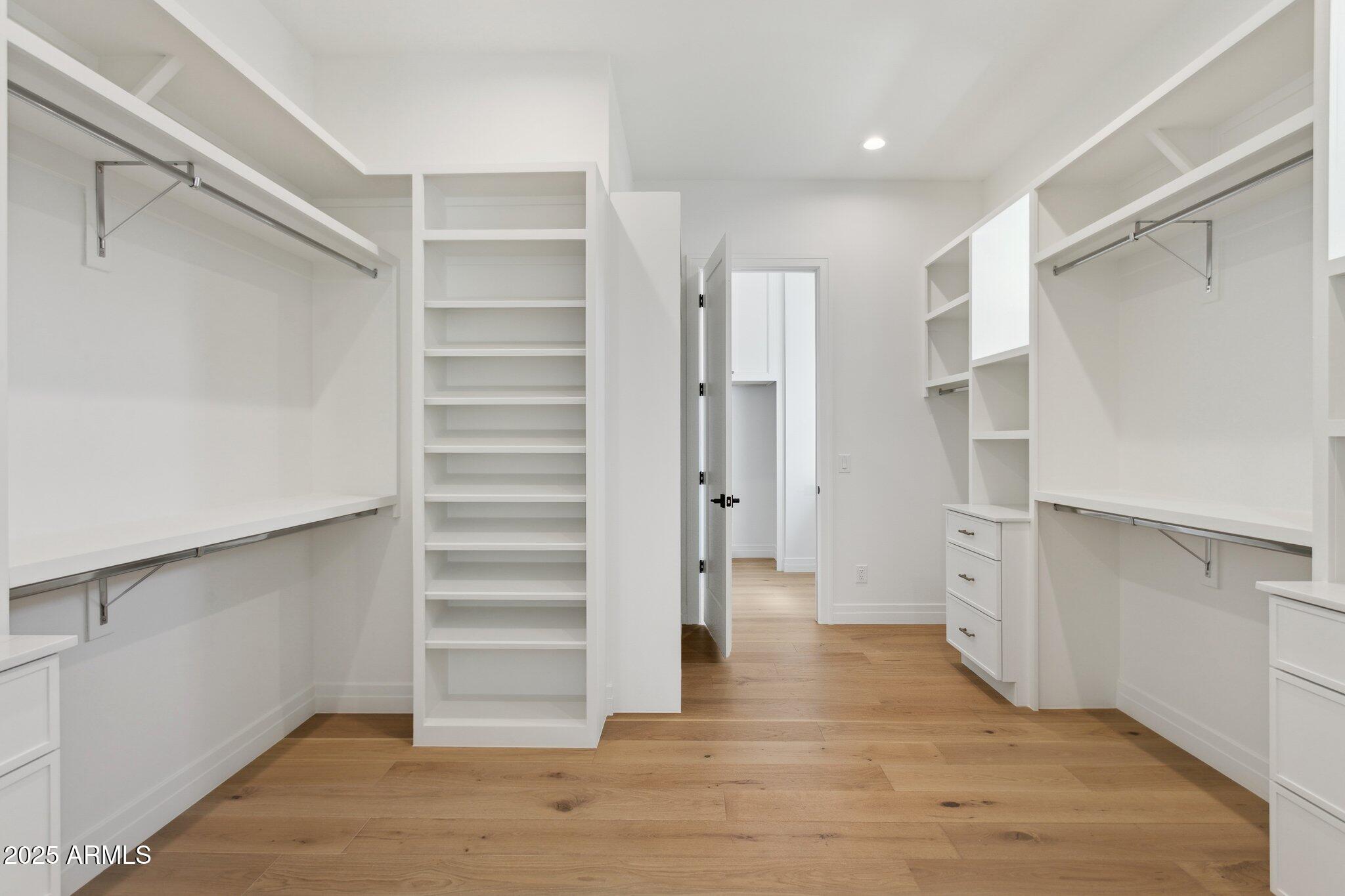 2942 North 47th Place Phoenix, AZ 85018 - Photo 23 of 40 a view of walk in closet with empty racks