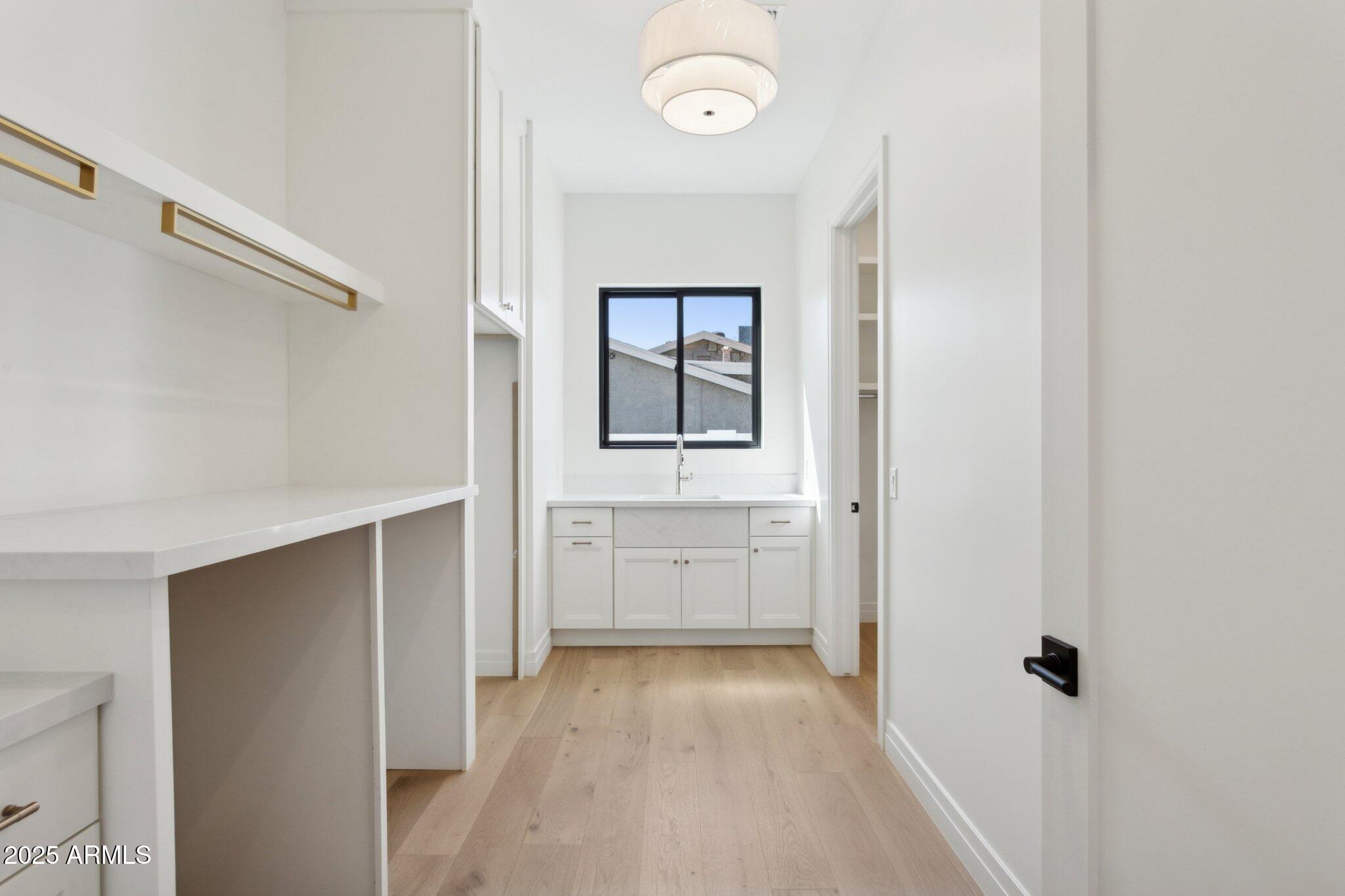 2942 North 47th Place Phoenix, AZ 85018 - Photo 24 of 40 a view of walk in closet with window