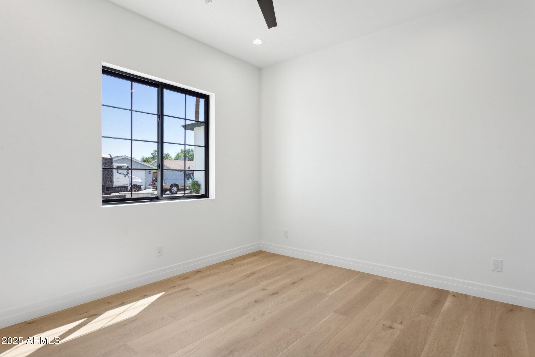 2942 North 47th Place Phoenix, AZ 85018 - Photo 31 of 40 an empty room with windows