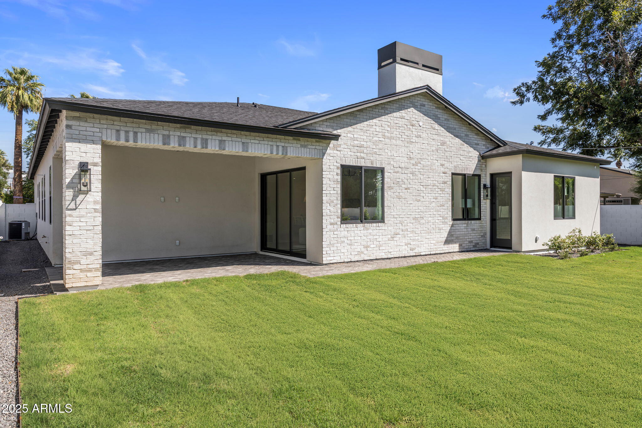 2942 North 47th Place Phoenix, AZ 85018 - Photo 38 of 40 a front view of a house with a yard