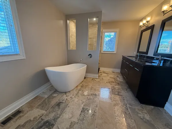 a bathroom with a sink and mirror