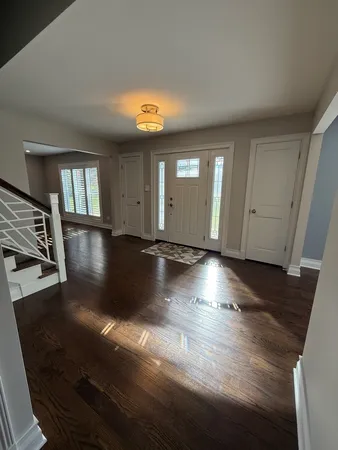 a view of a livingroom with wooden floor