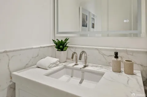 a bathroom with a sink and mirror