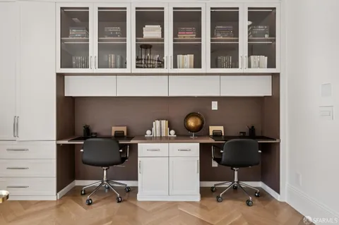a kitchen with stainless steel appliances a sink and a large window