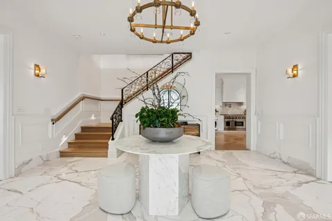 a dining hall with a dining table and chairs