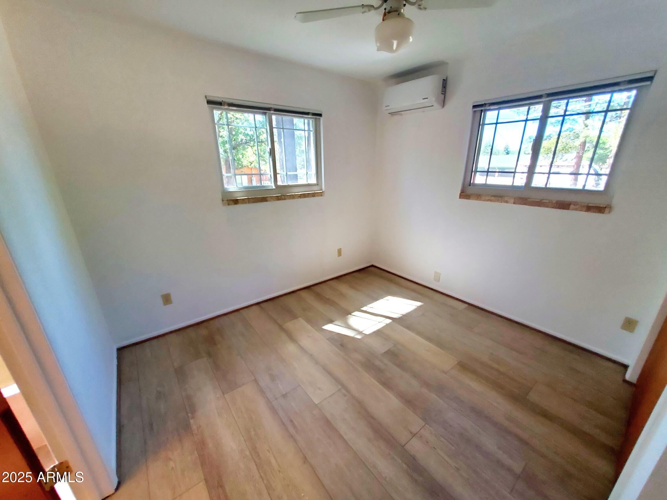 8449 Elk Road Pine, AZ 85544 - Photo 16 of 24 an empty room with windows