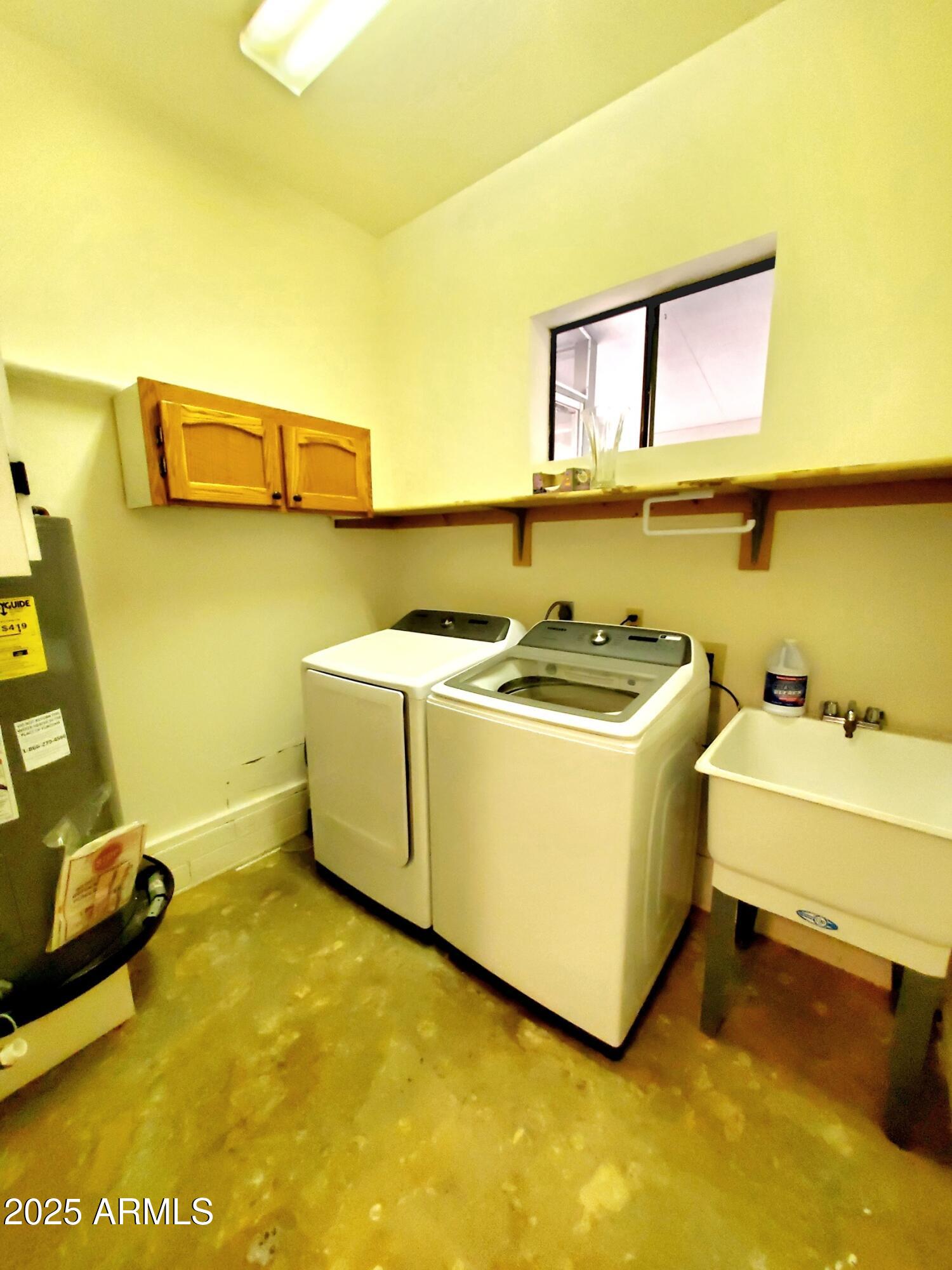 8449 Elk Road Pine, AZ 85544 - Photo 22 of 24 a utility room with a sink a washer and dryer