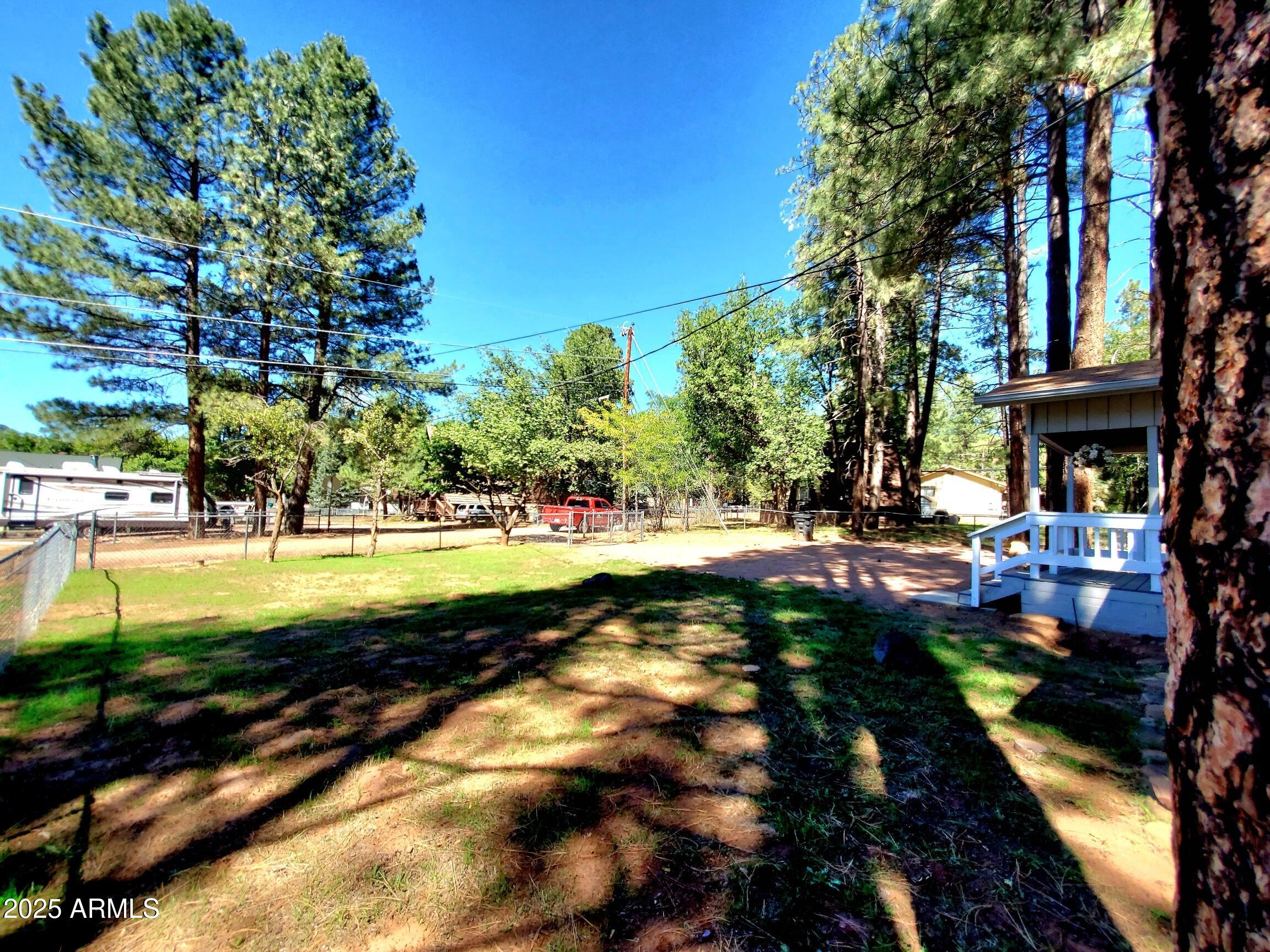 8449 Elk Road Pine, AZ 85544 - Photo 5 of 24 a view of yard with swimming pool and green space