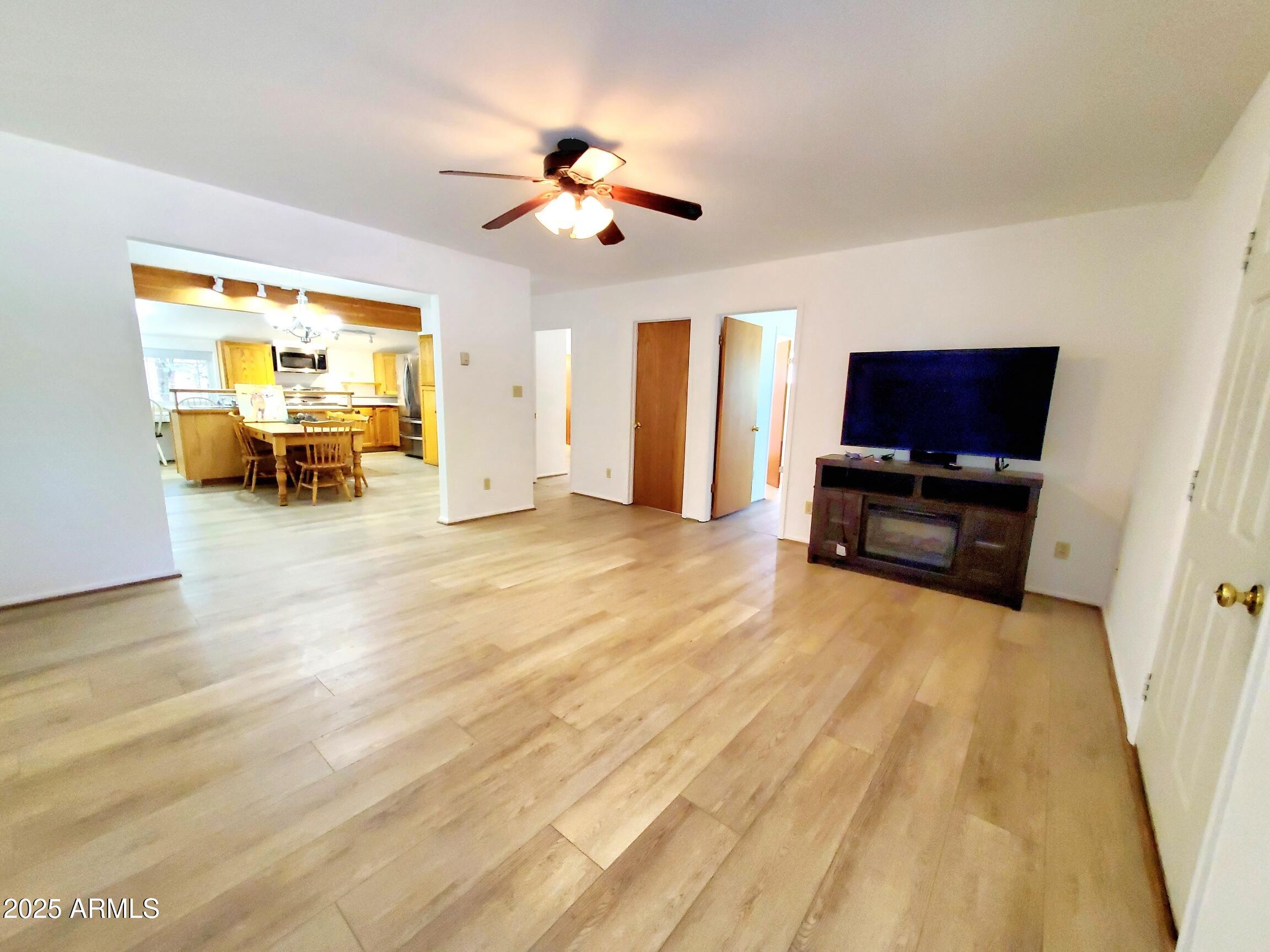 8449 Elk Road Pine, AZ 85544 - Photo 7 of 24 a living room with furniture and a flat screen tv