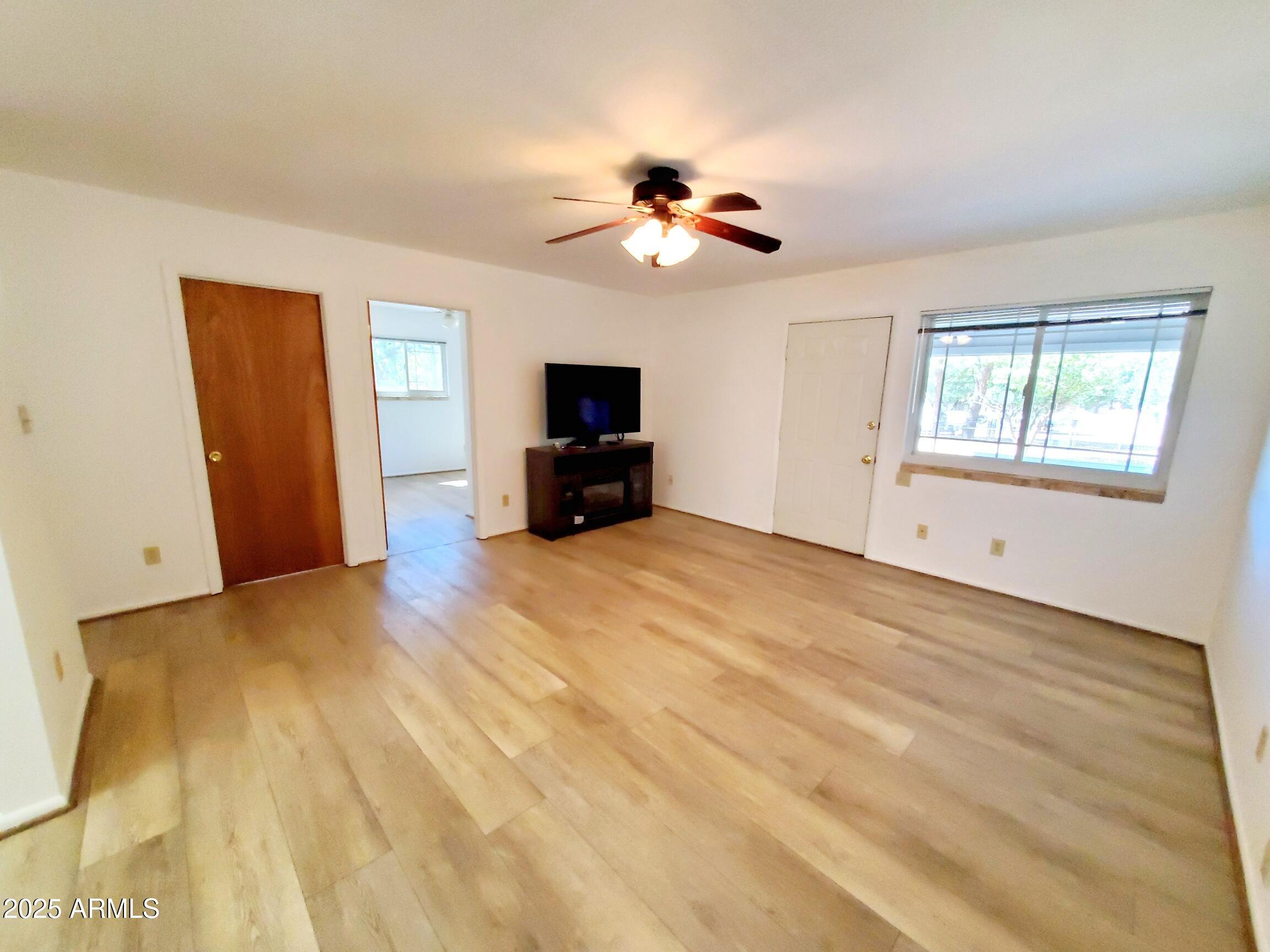8449 Elk Road Pine, AZ 85544 - Photo 9 of 24 a view of empty room with a fireplace