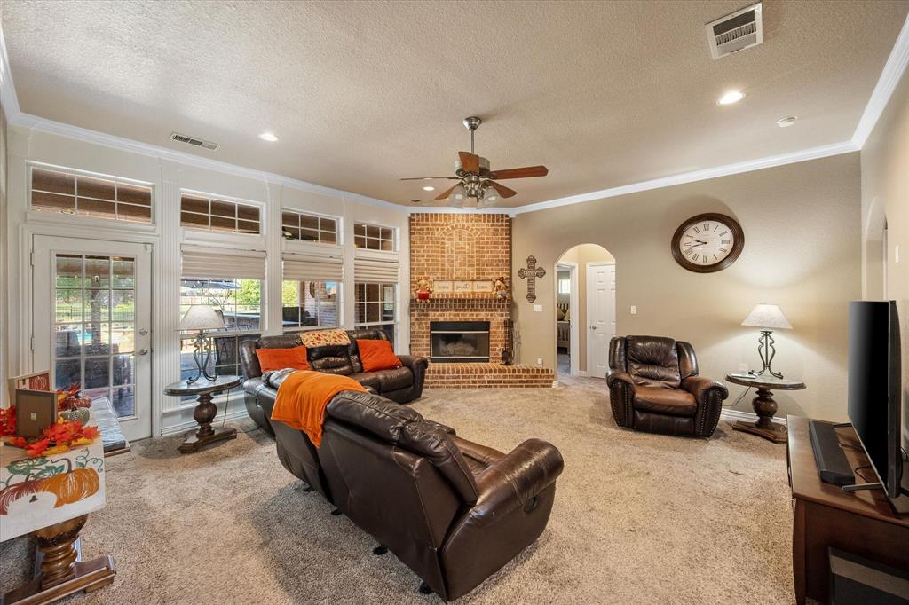 3600 Doris Walker Trail Burleson, TX 76028 - Photo 11 of 40 a living room with fireplace furniture and a flat screen tv
