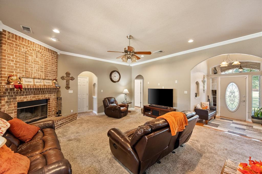 3600 Doris Walker Trail Burleson, TX 76028 - Photo 12 of 40 a living room with furniture a fireplace and a large window