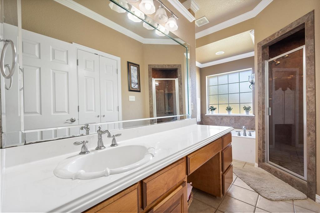 3600 Doris Walker Trail Burleson, TX 76028 - Photo 17 of 40 a bathroom with a sink double vanity and a shower