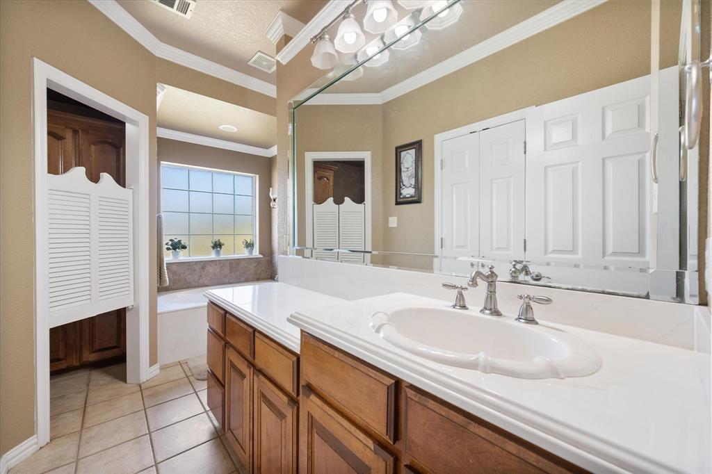 3600 Doris Walker Trail Burleson, TX 76028 - Photo 18 of 40 a bathroom with a sink double vanity and a mirror