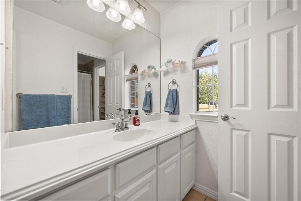 3600 Doris Walker Trail Burleson, TX 76028 - Photo 22 of 40 a bathroom with a sink and a mirror
