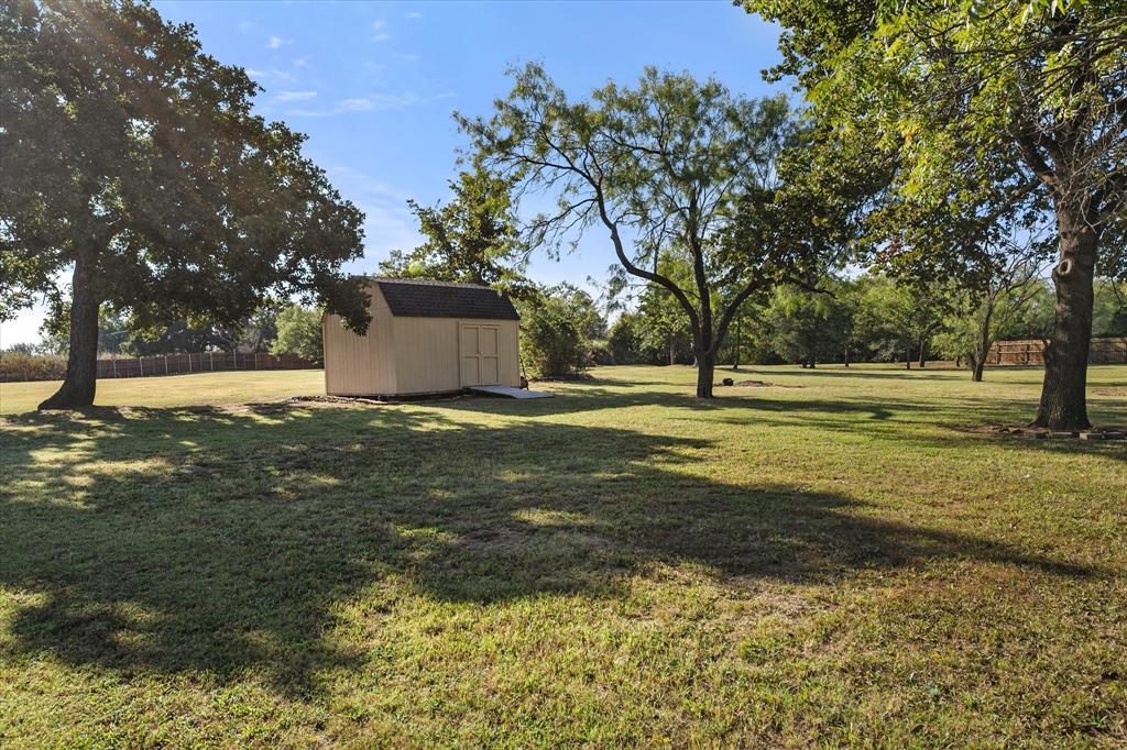 3600 Doris Walker Trail Burleson, TX 76028 - Photo 36 of 40 a view of a yard with a house and large trees