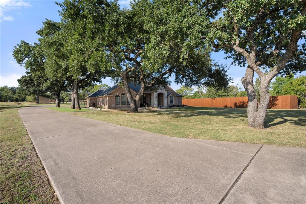 3600 Doris Walker Trail Burleson, TX 76028 - Photo 37 of 40 a house with trees in front of it
