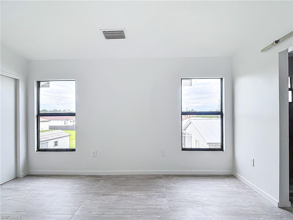 3710 10th Street Southwest Lehigh Acres, FL 33976 - Photo 15 of 30 an empty room with windows