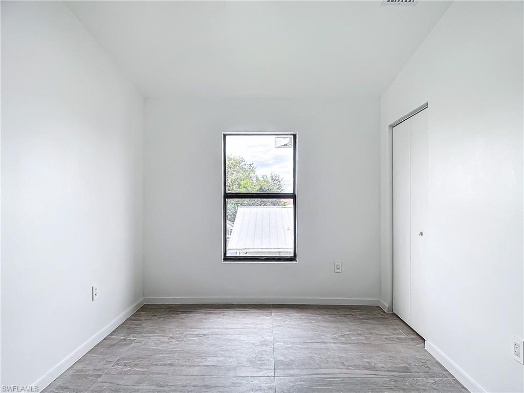 3710 10th Street Southwest Lehigh Acres, FL 33976 - Photo 23 of 30 an empty room with a window