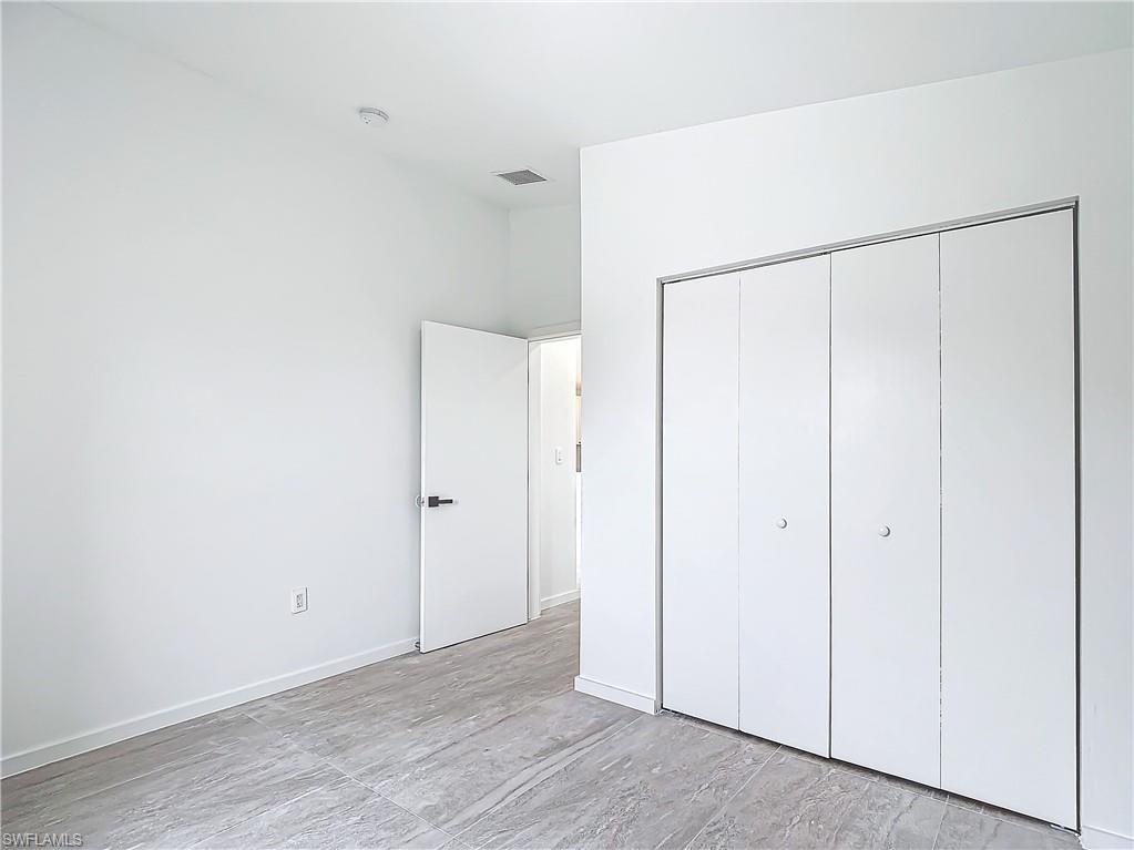 3710 10th Street Southwest Lehigh Acres, FL 33976 - Photo 25 of 30 a view of an empty room