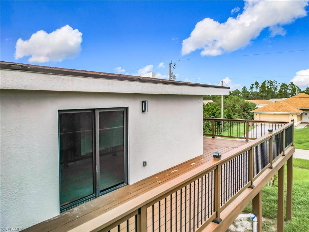 3710 10th Street Southwest Lehigh Acres, FL 33976 - Photo 28 of 30 a view of a porch with a table and chairs