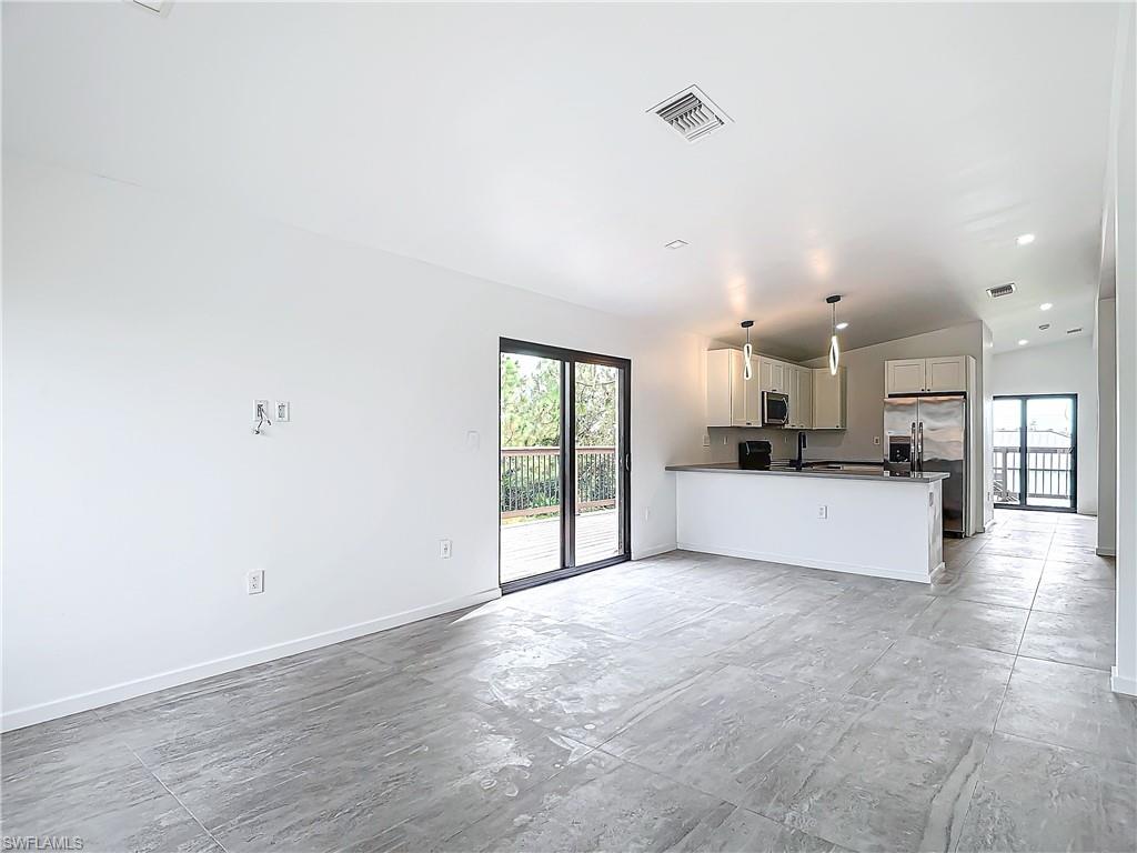 3710 10th Street Southwest Lehigh Acres, FL 33976 - Photo 5 of 30 a view of a kitchen with a sink and a window