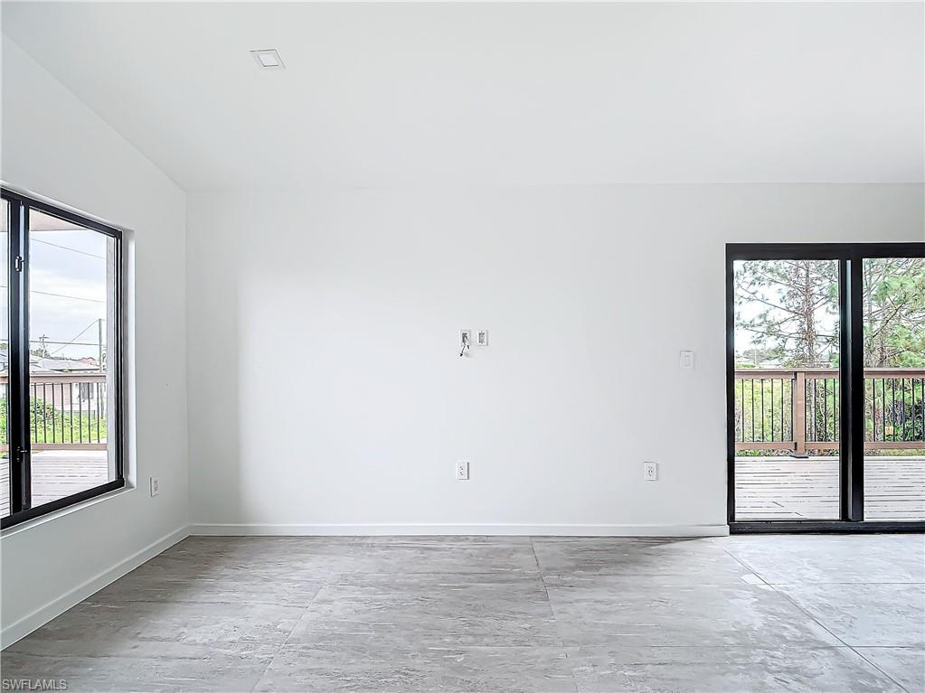 3710 10th Street Southwest Lehigh Acres, FL 33976 - Photo 6 of 30 an empty room with windows